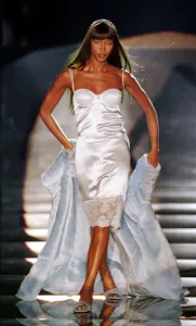 Naomi Campbell modelling a white slip dress March 1999 for designer Rocco Barocco Naomi Campbell modelling a white slip dress March 1999 for designer Rocco Barocco