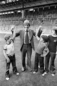 New Liverpool signing Kenny Dalglish with fans on the pitch at Anfield as he completes New Liverpool signing Kenny Dalglish with fans on the pitch at Anfield as he completes