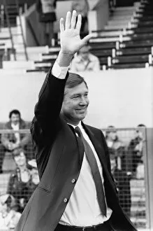 Images Dated 8th November 1986: New Manchester United manager Alex Ferguson waves to the crowd before his first match in