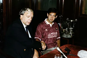 New signing Graeme Hogg with Hearts Manager Wallace Mercer at Tynecastle in Edinburgh New signing Graeme Hogg with Hearts Manager Wallace Mercer at Tynecastle in Edinburgh
