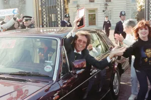 A newly-knighted Sir Cliff Richard leaves Buckingham Palace waving his gong aloft A newly-knighted Sir Cliff Richard leaves Buckingham Palace waving his gong aloft