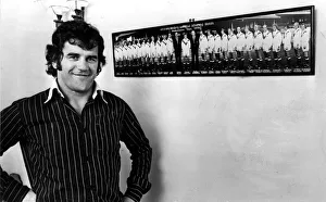 Former Newport and Wales international David Watkins pictured in front of a photo of Former Newport and Wales international David Watkins pictured in front of a photo of