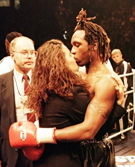 Nigel Benn kisses his girlfriend after his defeat by Steve Collins for WBO super Nigel Benn kisses his girlfriend after his defeat by Steve Collins for WBO super