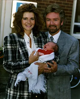 Noel Edmonds Tv Presenter with new born baby Olivia and wife Helen Noel Edmonds Tv Presenter with new born baby Olivia and wife Helen