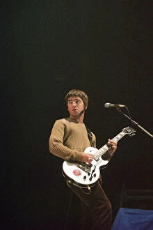 Images Dated 16th September 1997: Noel Gallagher of Oasis performing at Newcastle Arena during their Be Here Now Tour