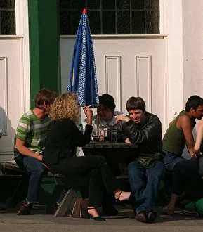 noel gallagher of Oasis sits outside the load of hay pub with mystery blonde noel gallagher of Oasis sits outside the load of hay pub with mystery blonde