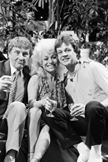 Images Dated 23rd May 1984: Norman Collier with Barbara Windsor and her boyfriend Stephen Hollings filming a TV show