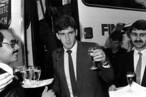 Norman Whiteside of Manchester United raises a glass after getting of the team coach Norman Whiteside of Manchester United raises a glass after getting of the team coach