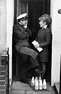 Images Dated 21st December 1972: Norman Wisdom: Norman chats to Mrs. Agnes Kirwan on the doorstep. December 1972