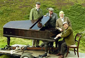 Norman Wisdom in his role as Billy Ingleton the piano player in the BBC situation comedy Norman Wisdom in his role as Billy Ingleton the piano player in the BBC situation comedy