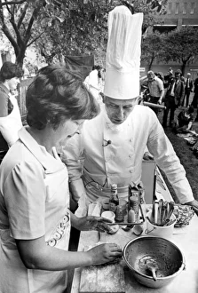 North East Festivals A cook takes some tips from a chef in the cook-o-ton in Old North East Festivals A cook takes some tips from a chef in the cook-o-ton in Old