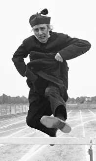 The Nun's Olympics. Spike Milligan dressed as a Roman Catholic priest seen here The Nun's Olympics. Spike Milligan dressed as a Roman Catholic priest seen here