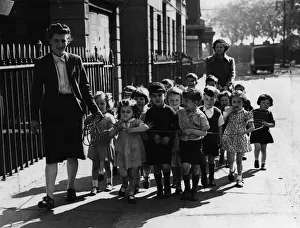 A nurse of Pimlico Day nursery takes the children out for a walk A nurse of Pimlico Day nursery takes the children out for a walk