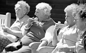 Old ladies sitting on a bench eating ice cream during a day out to the beach at Trecco Old ladies sitting on a bench eating ice cream during a day out to the beach at Trecco