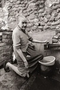 Old Mary Wallace washes her dishes outside in hubert Street in Newtown cardiff Old Mary Wallace washes her dishes outside in hubert Street in Newtown cardiff