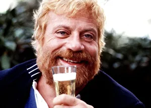 Oliver Reed drinks a glass of champagne 1986 Oliver Reed drinks a glass of champagne 1986