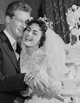 Pamela and David Moore cut the cake at their reception. Pamela was the Daily Mirror Pamela and David Moore cut the cake at their reception. Pamela was the Daily Mirror