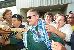 Paul Gascoigne is mobbed by airport workers and Lazio fans on arrival in Rome Paul Gascoigne is mobbed by airport workers and Lazio fans on arrival in Rome