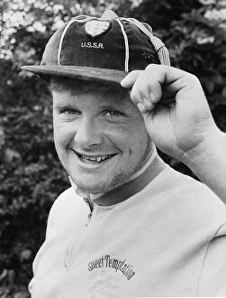 Images Dated 18th June 1988: Paul Gascoigne proudly displays one of his under 21 caps as well as a touch of designer
