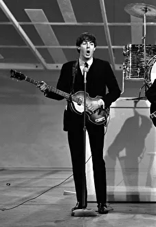Paul McCartney playing guitar in New York during the Beatles first tour of America Paul McCartney playing guitar in New York during the Beatles first tour of America