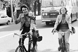Images Dated 8th October 1972: Paul McCartney and wife Linda McCartney riding bicycles in London