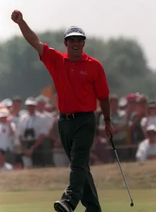 Paul McGinley Golfer salutes to the crowd after scoring a birdie on the 17th hole Paul McGinley Golfer salutes to the crowd after scoring a birdie on the 17th hole