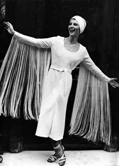 Paula Daly models a midi-length evening dress with eye-catching fringed sleeves Paula Daly models a midi-length evening dress with eye-catching fringed sleeves
