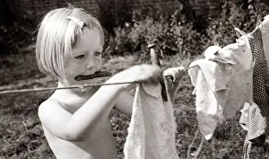 Pauline Carey aged 2 and a half hanging out the laundry to dry at the Hampstead (London Pauline Carey aged 2 and a half hanging out the laundry to dry at the Hampstead (London