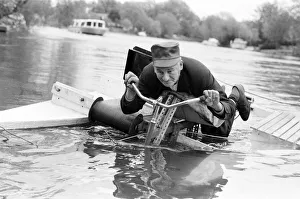 Pensioner Patrick Thomas pictured on his lying down bicycle equipped with floats as he Pensioner Patrick Thomas pictured on his lying down bicycle equipped with floats as he