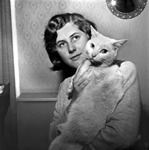 People with Animals: A Woman holding up her pet cat. November 1969 Z10902 People with Animals: A Woman holding up her pet cat. November 1969 Z10902