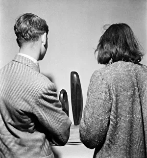 People examining pieces of art at the Exhibition of Sculpture at Burlington Galleries People examining pieces of art at the Exhibition of Sculpture at Burlington Galleries