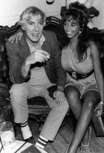 Peter Cook comedian actor and satarist, in July 1987 with topless model Maria Whittaker Peter Cook comedian actor and satarist, in July 1987 with topless model Maria Whittaker