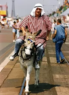 Images Dated 20th July 1990: Peter Howitt Actor riding on a donkey A©Mirrorpix