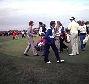 Peter Oosterhuis and Nick Faldo of the European Ryder Cup team shaking hands with their Peter Oosterhuis and Nick Faldo of the European Ryder Cup team shaking hands with their