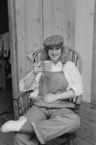Photo shows Helen Mirren seated in her country Windsor chair wearing her favourite cap Photo shows Helen Mirren seated in her country Windsor chair wearing her favourite cap