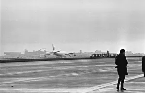 Photographer on the apron following the arrival of the first Boeing 747 ' Photographer on the apron following the arrival of the first Boeing 747 '
