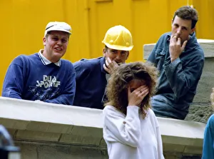 A picture showing the stereotypical behaviour of workmen wolf whistling pretty girls A picture showing the stereotypical behaviour of workmen wolf whistling pretty girls