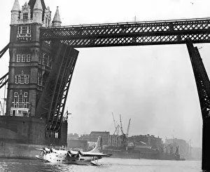 Picture shows the first flying boat on the Thames for 21 years-passing under Tower Bridge Picture shows the first flying boat on the Thames for 21 years-passing under Tower Bridge