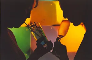 A picture of a woman drinking a cocktail enjoying a night out A picture of a woman drinking a cocktail enjoying a night out