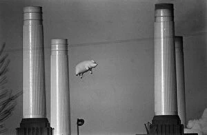 Images Dated 4th December 1976: Pink Floyd Inflatable Flying Pig at Battersea Power Station in London during filming of