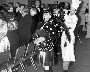 Pipe Major J. C. Mason piping in the haggis for the Newcastle Pipe Major J. C. Mason piping in the haggis for the Newcastle