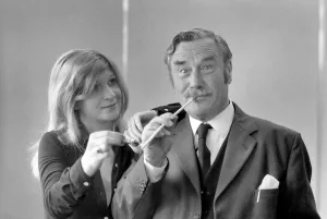 Pipe smoking Champion Robert Locke of Hayes, Middlesex, is pursued by typist Liliana Pipe smoking Champion Robert Locke of Hayes, Middlesex, is pursued by typist Liliana
