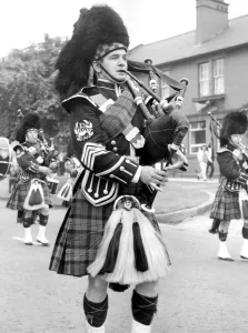 Pipers marching along and playing in July 1971. 12/07/71 Pipers marching along and playing in July 1971. 12/07/71