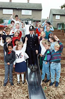 Playtime... community constable PC Adrian Denby tests the slide in Reinwood Infant Playtime... community constable PC Adrian Denby tests the slide in Reinwood Infant