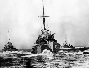 Ploughing steadily through the broken water, these destroyers of a British flotilla at Ploughing steadily through the broken water, these destroyers of a British flotilla at