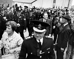 A police escort surrounds controversial Tory candidate Enoch Powell when he arrived to A police escort surrounds controversial Tory candidate Enoch Powell when he arrived to