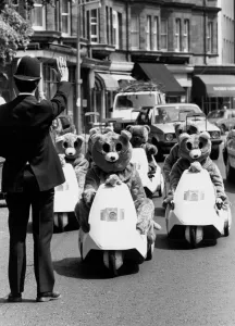 A policeman gestures to halt a rally of motor bears on C5s in London A policeman gestures to halt a rally of motor bears on C5s in London