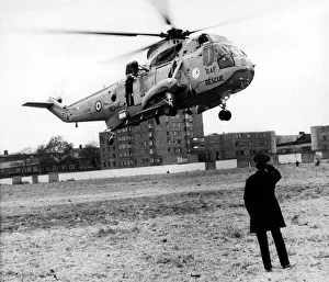 A policeman looks on as a RAF search and rescue Sea King helicopter from RAF Boulmer A policeman looks on as a RAF search and rescue Sea King helicopter from RAF Boulmer