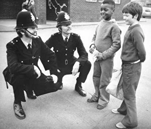 Images Dated 11th March 1977: Two policemen on the beat in Coventry, stop to chat with a couple of young lads