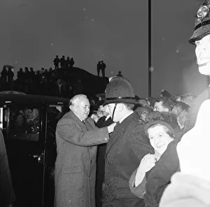 Policemen hold back the crowds as Prime Minister Harold Wilson (1916 - 1995 Policemen hold back the crowds as Prime Minister Harold Wilson (1916 - 1995